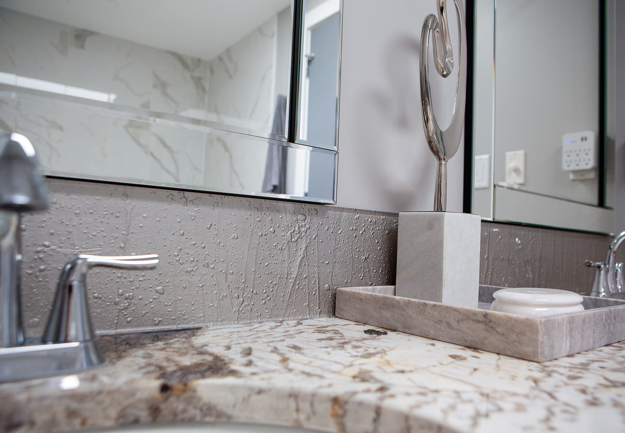 gray firemolded glass backsplash in a bathroom